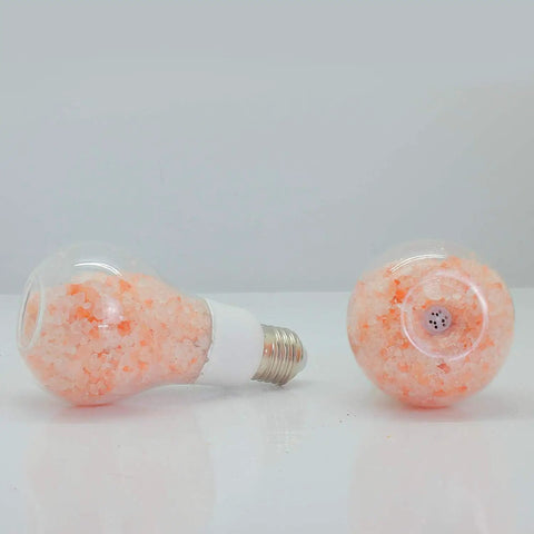 Salt Lamp Inspired LED Bulb With Lit Warm Amber Glow, 60W Equivalent Dimmable A19 Edison Bulb, two bulbs on a white surface