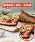 Close-up of a pizza slice with crispy crust on wooden board, showcasing High Heat Pizza Steel For Oven And Grill 13 By 13 Inch One Quarter Inch Thick With Lifting Holes Baking Stone For Oven And Grill Creates Crispy Crust And Rich Flavor For Pizza Sourdough Bread Cookies And More