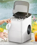 Solid Countertop Automatic Ice Maker For Kitchens Or Game Rooms Producing Fast Crystal Clear Cubes In Minutes with user dispensing ice.