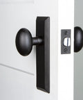 Keep Plate Set With Aeg Knob In Black Iron For Modern Doors Dope Rustic Matte Black Hardware on white door from the side