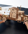 Heavy Duty 6 Cylinder Rubber Band Powered Truck Model Kit 3D Puzzle For Adults Semi Truck Hobby Build Brain Teaser Wooden Mechanical Kit For Home Decor And Collectors wooden semi truck model being assembled by hands