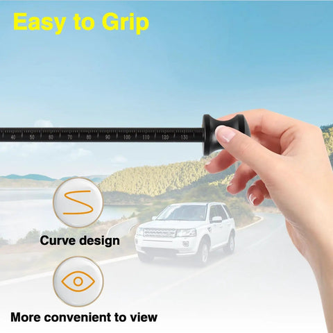 Hand holding transmission dipstick with grip over scenic road, Transmission Dipstick Replacement For 6F24 Automatic Transmissions 10323A 10323B