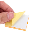 Person's hand peeling back yellow tape from Hella Handy Six Piece Solderless Breadboard Kit for Circuit Prototyping.