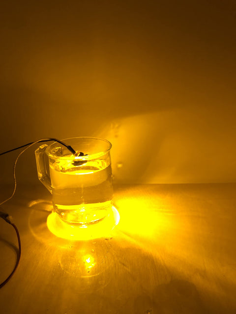 50 Pcs Three Quarter Inch Amber LED Marker Lights Kit, round amber side marker in water, glowing on flat surface
