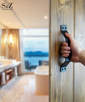 Hand gripping 9 Inch Sliding Barn Door Handle Set In Black Frosted Finish, Heavy Duty Carbon Steel Door Pull, installed on wood door.