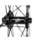 Close-up of Carbon Disc Wheelset Tubeless Ratchet Bike Wheel 700C 50mm Black hub and spokes for through axles.