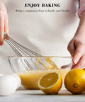 Go-To Stainless Steel Balloon Whisk in use with lemon and eggs for baking, showing 8-inch durable wire whisk blending batter in glass bowl.
