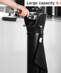 Top Shelf 6.8 Liter Espresso Knock Box Coffee Grounds Bucket With Quiet Rubber Arm Removable Lid Heavy Duty Frame, black knock box in use.