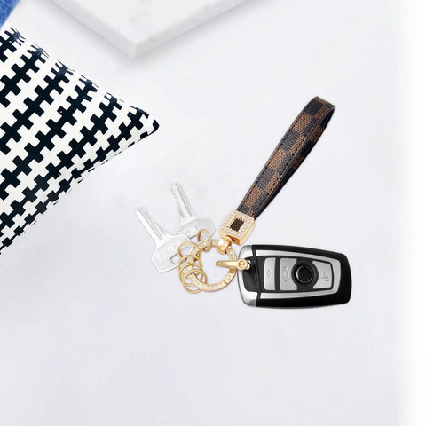 Dope And Totally Legit Premium Leather Wristlet Keychain Featuring Sparkling Crystal Diamonds And Classy Craft Pearls with keys on a surface.