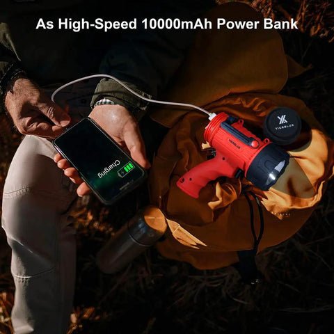 Person charging phone with Rechargeable Spotlight Flashlight With 2 Million Lumen LED IP67 Waterproof Long Running Searchlight