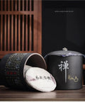 Heavy Duty Ceramic Food Storage Jar With Airtight Silicone Lid Keeps Your Pantry Looking Fresh And Organized Perfect For Bulk Tea Coffee Beans Spices Sugar And Cookies Retro Kitchen Container That Truly Hits Different, showing black ceramic jar with tea cakes.