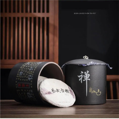 Heavy Duty Ceramic Food Storage Jar With Airtight Silicone Lid Keeps Your Pantry Looking Fresh And Organized Perfect For Bulk Tea Coffee Beans Spices Sugar And Cookies Retro Kitchen Container That Truly Hits Different, showing black ceramic jar with tea cakes.