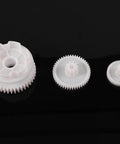 Three plastic gears from 550 Gear Box Set For Kids Must Have Ride On Car Replacement Gears Kit Large Middle Small Drive Gears