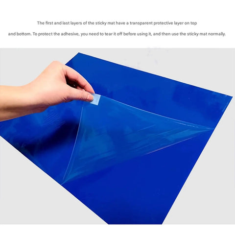 Image showing hand peeling a protective layer off a Heavy Duty 300 Sheet Peel Away Floor Mat, Gray 24 By 36 Inch size.