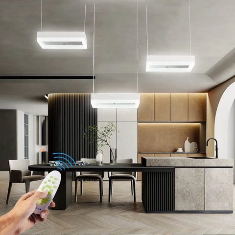 Integrated LED Pendant Light With Dimmable Color Changing LEDs Remote Control 3 Light Dope Modern Ceiling Fixture For Kitchen Island And Dining Room Energy Efficient Easy Install Sleek Contemporary Design illuminating a kitchen.
