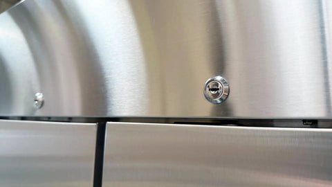 Close-up of a lock mechanism on the Heavy Duty Commercial Reach In Freezer, Two Door Stainless Steel Bottom Mount Upright Unit.