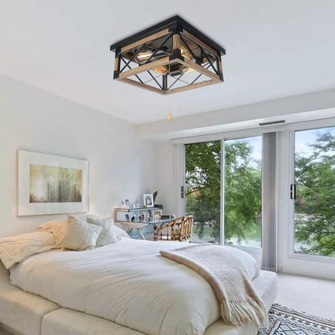 Farmhouse Flush Mount Cage Light With Adjustable Pull Chain, Square Wood Rustic Ceiling Fixture In Black Metal Industrial Style For Living Room And Bedroom installed in a bright bedroom