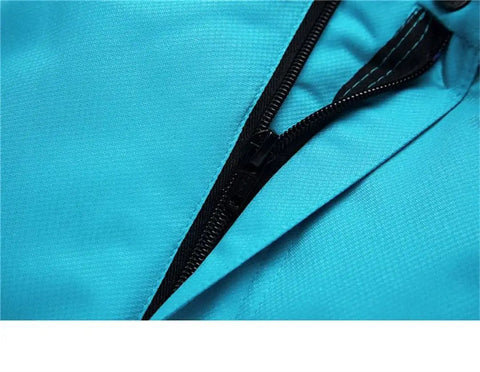 Close-up of All Terrain Snow Bibs for Men and Women with zipper detail showcasing durable ripstop shell in black large
