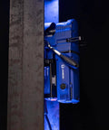 Unibor low-profile magnetic drill press, blue, mounted on a steel workpiece with LED light.