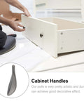 Installation of Dope Loquat Leaf Zinc Alloy Cabinet Pulls And Drawer Handles Set In Pearl Gray Finish on a white drawer