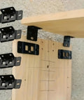 Heavy Duty Stainless Steel Furniture Connectors 10 Pack Built Like An Ox Corner Brackets mounted on a wooden surface.