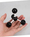 Hands On Molecular Model Kit For Chemistry Education Classroom Science Teaching Tool Build Realistic Molecular Structures. Hand holding small black and white plastic model.