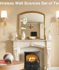 Premium Gold Wall Sconces Set Of 2 with a soft glow, complementing a stylish living room decor near a fireplace.