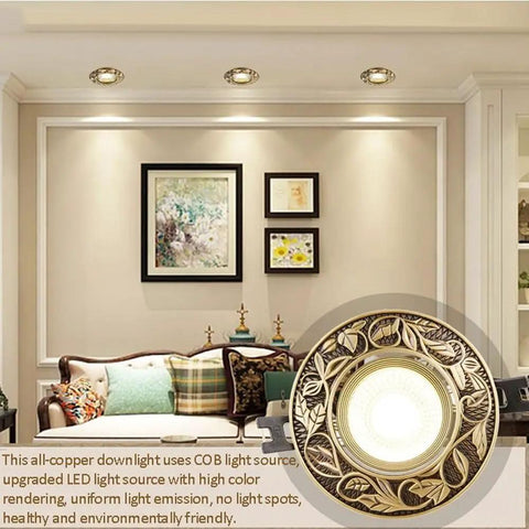 Slick 12 Pack 7W LED Dimmable Recessed Ceiling Lights With Vintage Brass Grille Finish in living room setting.