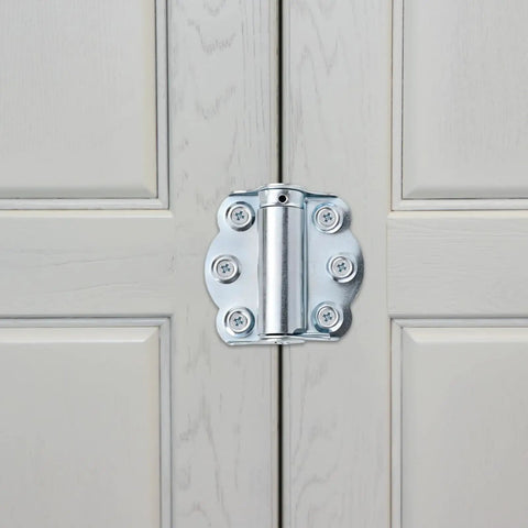 Solid As A Rock Self Closing Door Hinges 3 Piece Set Corrosion Resistant Zinc Springs mounted on a light gray cabinet door.