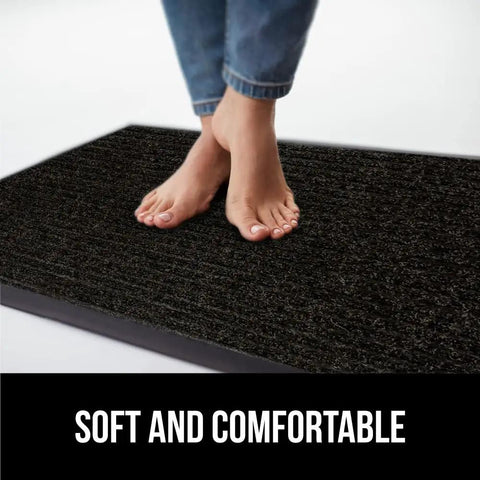 Feet on black Beefy Heavy Duty Door Mat For High Traffic Areas Waterproof Traffic Guard Entryway Rug With Rubber Backing