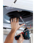 Person using 12V Max Impact Driver Kit With 930 In Lbs Torque Ultra Compact Five Point Four Inch Head For Tight Spaces Lightweight