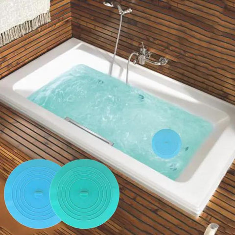Slick Silicone Tub Stopper Two Pack, 5 Inch Flat Suction Bath Plug With Heavy Grip, Catches Every Stray Hair And Stops Water Drips No Leak Nonsense For Bathtubs And Sinks, Blue And Green Kit displayed in bathtub with water.