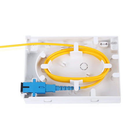 PNGKNYOCN 2-port fiber optic terminal junction box with blue SC/UPC connector and yellow fiber on white desktop panel