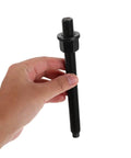 Hand holding a bolt from the Crankshaft Pulley Removal Tool Gear Puller Kit For Engine Timing Belt And Drive Pulley Disassembly