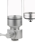 Sleek Airtight Coffee Bean Dispenser With Thick Clear Glass Lid showing silver metal base and smooth pour spout detail.