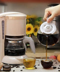 Zero Hassle Full Automatic Bean To Cup Coffee Maker pouring coffee into cups with a compact white design for home or office use.