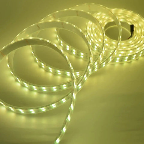 Five 5M RGB LED Strips Kit With IP67 Waterproof Silicone Sleeve, SMD5050 Double Row 120 LEDs Per Meter coiled on a surface.