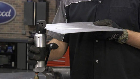Person using Pneumatic Sheet Metal Puncher And Flange Rivet Tool With Air Connector for quick seam repairs on metal sheet