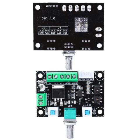 Front view of two stepper motor controller boards; bottom green screw-terminals, top black control board.