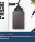 Cloning Kit Pro For SSD And HDD Upgrades, Version 7 Software Download, 4K Sector Compatible, Easy No Fuss File Exclusion, Boss Upgrade Tool, Includes SATA To USB Adapter For 2.5 Inch SSD And HDD, Fast And Reliable Disk Duplication. black SATA to USB adapter beside laptop keyboard