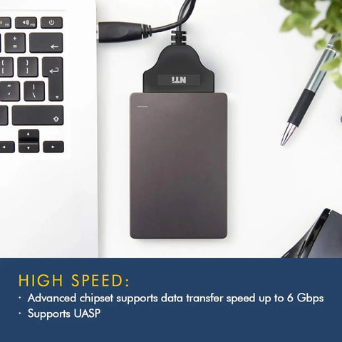 Cloning Kit Pro For SSD And HDD Upgrades, Version 7 Software Download, 4K Sector Compatible, Easy No Fuss File Exclusion, Boss Upgrade Tool, Includes SATA To USB Adapter For 2.5 Inch SSD And HDD, Fast And Reliable Disk Duplication. black SATA to USB adapter beside laptop keyboard