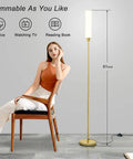 Gold Floor Lamp With Remote And Foot Switch, 360 Degree LED Light, Stepless Dimming From 3000K To 6000K next to seated woman in room