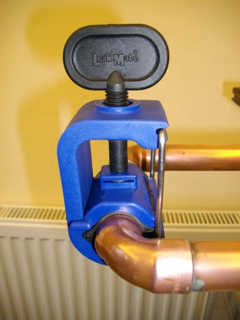 Emergency Pipe Repair Tool That Stops Leaks Fast In Seconds clamped on 15 mm copper pipe showing leak sealer application