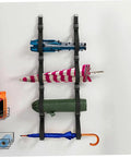 Heavy Duty Adjustable Wall Storage Straps For Garage Organization Rock Solid Wall Mount System holding umbrellas and gear on wall.