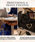 Gold Finish 22K Purse Hook For Table in use holding a blue handbag at a desk; heart-shaped holder in black bag with travel essentials.
