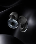 Switch 2 Adjustable Ear Plugs With Three Noise Reduction Modes Quiet Engage Experience For Focus Travel Socializing And Festival Vibes Dial For Instant Relief 20 To 26 dB SNR, shown in a detailed close-up on a black background, highlighting the sleek design and materials.