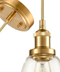 Close-up of gold pendant lights for kitchen island three-pack with mini bell glass shades, industrial brass finish, durable design.