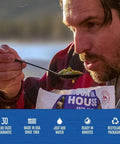 Man enjoying Buffalo Style Chicken Mac And Cheese Freeze Dried Camping Meal With 12 Servings And 30 Year Shelf Life outdoors