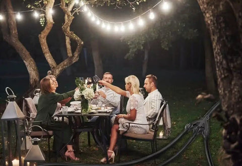 Outdoor dining scene using 300 Ft Outdoor Indoor Extension Cord With 3 Outlets Heavy Duty 16 Gauge 3 Conductor