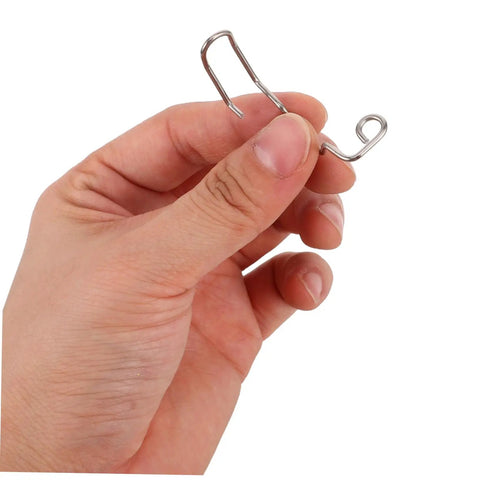 Close-up of hand holding metal Ten Pack Pro Grade Finger Guard Springs For Sewing Machines Hand Safety Shield Needle Guard Easy Install